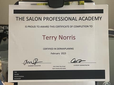 Certificate of completion from The Salon Professional Academy awarding Terry Norris certification in dermaplaning, February 2023